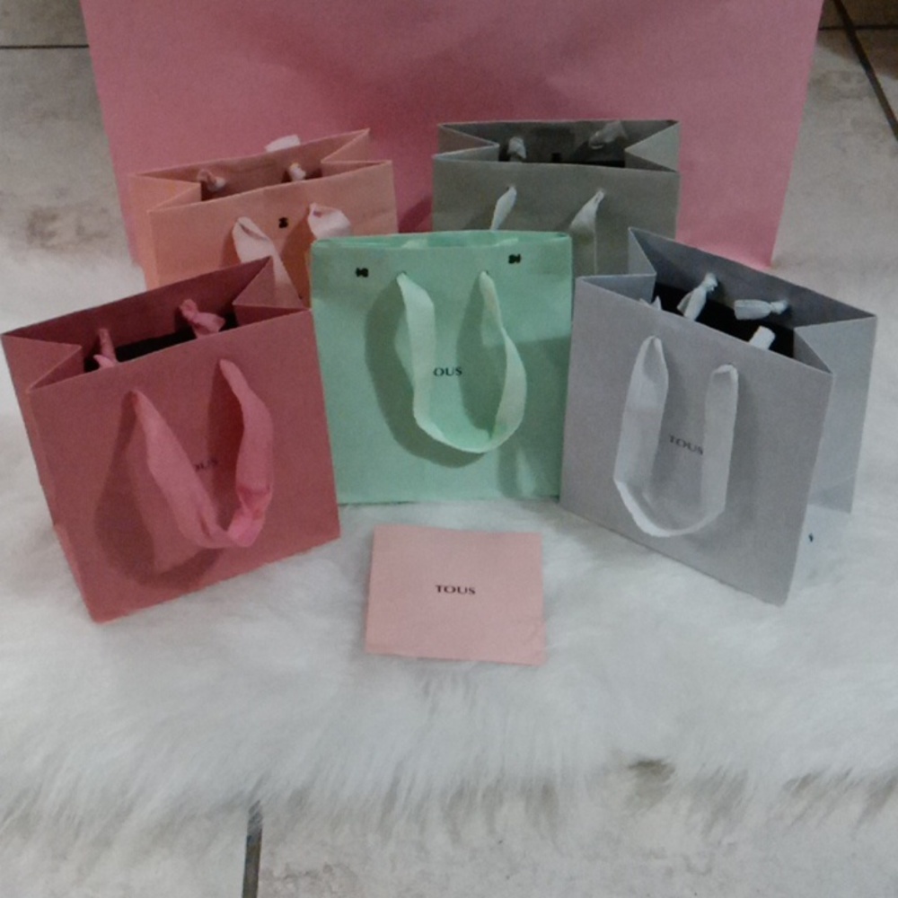 Bundle of 13 Tous bags and jewelry dust bags